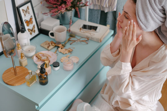 Woman Moisturizing Her Face