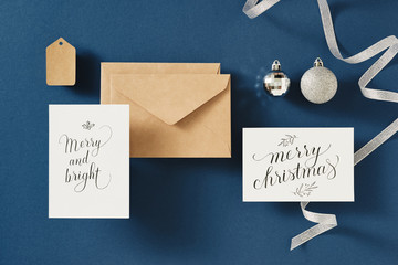 Christmas greeting card with envelope on blue background