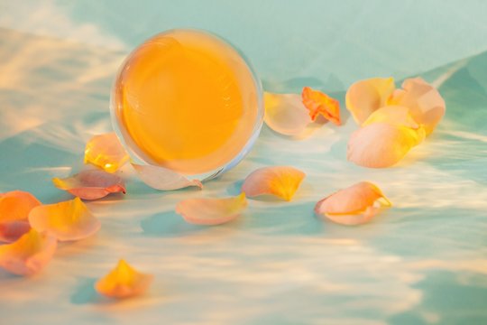 Flower petals around glass ball