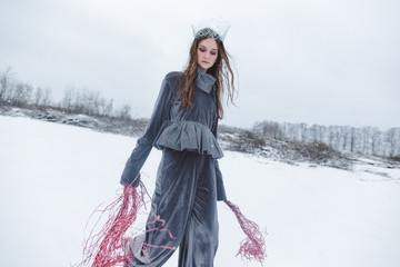 Snow queen dancing in the field.