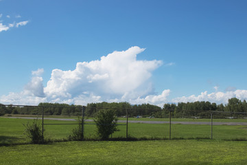 Large white, puffy clouds in sky during the day