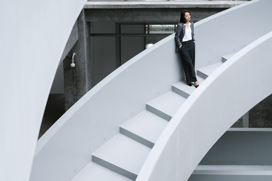 Businesswoman on office staircase