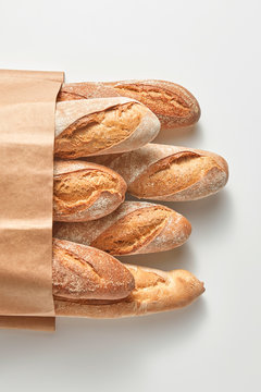 Homemade baguettes in a paper bag.