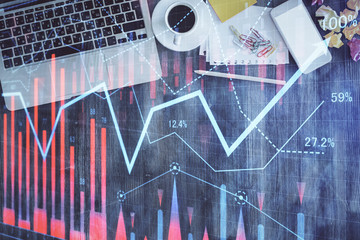 Stock market chart and top view computer on the table background. Multi exposure. Concept of financial analysis.