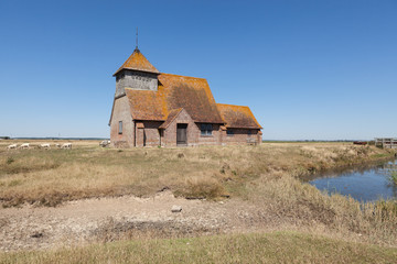 St Thomas à Becket Church in Fairfield, Kent, on a sunny day.