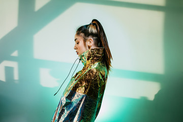 Young woman in metallic jacket