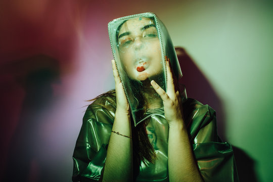Futuristic woman with bag on head