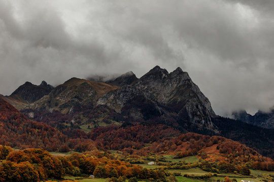 Landscape photography about the color of the mountain in autumn, with wonderful rocky mountains at behind.