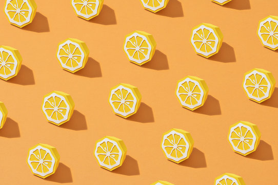Lemon fruit made of paper. Yellow background.