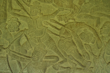 Fototapeta na wymiar Bas relief carving on a wall of warriors in battle