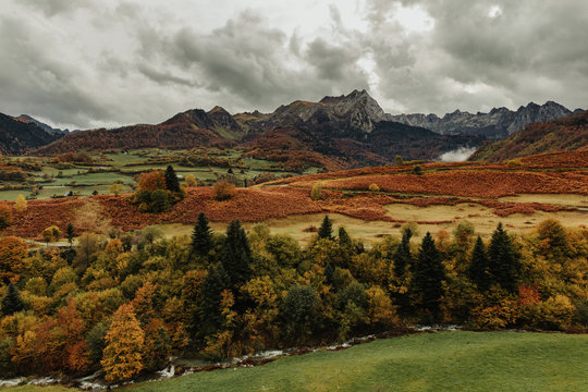 Landscape photography about the color of the mountain in autumn, with wonderful rocky mountains at behind.