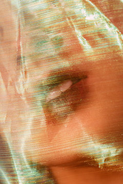 Female model under transparent veil