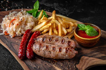 Grilled German sausages with potatoes and vegetables.