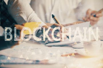 Double exposure of blockchain theme drawing over people taking notes background. Concept of cryptocurrency