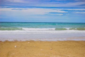 Fototapeta na wymiar Summer beach background. Sand, sea and blue sky. ocean