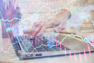 Multi exposure of woman hands typing on computer and forex chart hologram drawing. Stock market analysis concept.