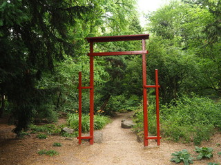 Fototapeta na wymiar A Japanesque shrine gate (Dendrological Garden in Przelewice (arboretum przelewice) Polan)