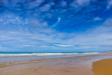 Naklejka na ściany i meble Summer beach background. Sand, sea and blue sky. ocean