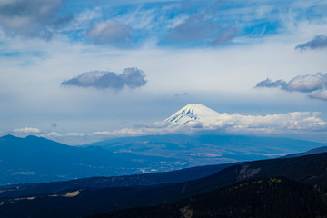 Fototapeta premium Aerial view of the mount Fuji with layered hills in the foreground. Landscape orientation.