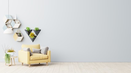 The interior has a yellow armchair on empty gray wall background.