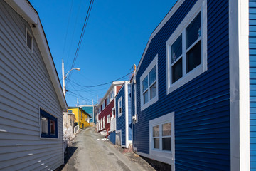 St. John's, NL/Canada-August 2020: One of the oldest neighborhoods in the City of St. John's called the Battery. The winding streets are narrow and the small wooden houses are painted bright colors.  