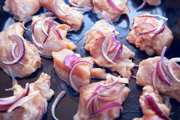 Raw meat with onions ready for cooking 