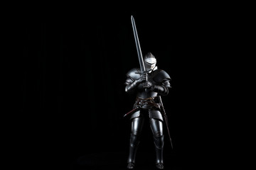 knight with sword blue velvet background