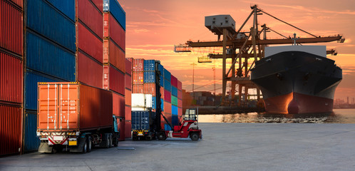 Logistics and transportaIndustrial Container Cargo freight ship, forklift handling container box...