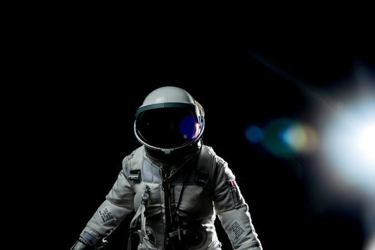 astronaut with lens flares and black background