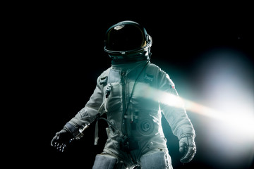 astronaut with lens flares and black background