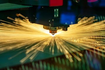The fiber laser cutting machine cutting  machine cut the metal plate. The hi-technology sheet metal manufacturing process by laser cutting machine.