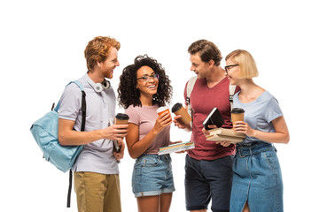 Students with coffee to go looking at african american friend with books isolated on white