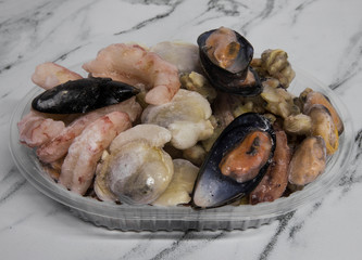 Frozen goods. Seafood. Uncooked shrimps, prawns, mussels, scallops, oysters and cockles. 