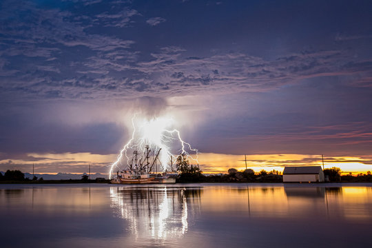Lightning on the River With Boats