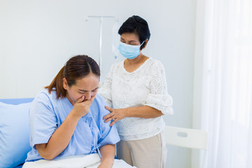 Fototapeta premium Mother visit and takes care of a sick daughter in the hospital.