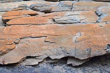 Red pattern of broken rock texture on the cliff