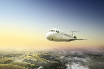 Naklejka na ściany i meble Airplane flying in the air above the landscape