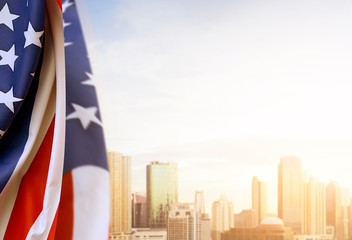 Naklejka premium American flag with cityscapes background