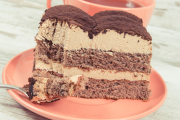 Tasty creamy tiramisu cake and black coffee for different occasions. Delicious dessert