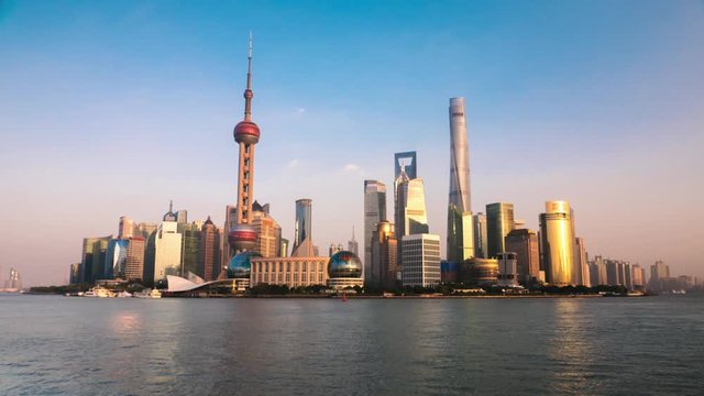 Shanghai - City view with skyscrapers, Oriental Pearl Tower and river with ships. 4K resolution time lapse.