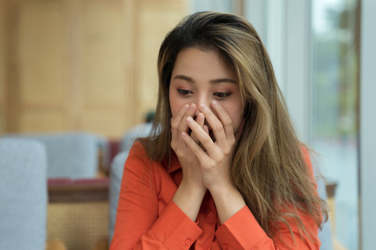 Portrait of young asian woman with happy screaming surprised face