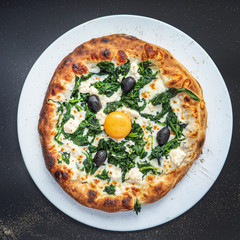 pizza on the black background, top view