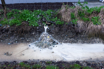Polluted storm water run-off from an industrial site, Motueka, New Zealand.