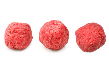 Raw meat balls isolated on white background.