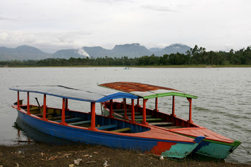 Twol boats in Situ Cileunca, Pangalengan, West Java, Indonesia. The atmosphere of Lake Cileunca with a row of boats leaning back