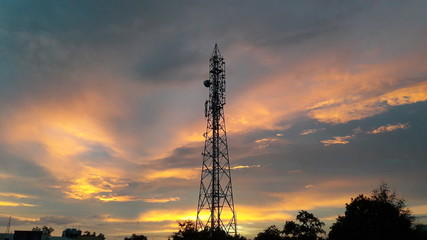 cellular tower with colourful sky background 