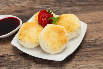 Curd pancakes with jam and stravberry