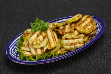 Grilled eggplant slices served basil
