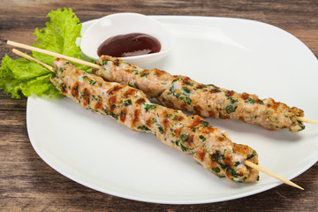 Minced pork skewer kebab with sauce