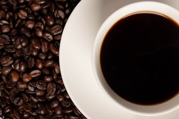 the cup of coffee with beans